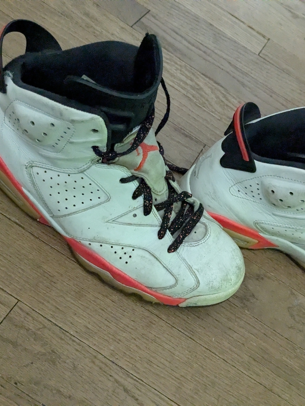 Air Jordan Retro Sneakers in White with Red Accent